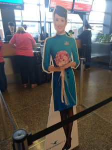 cardboard cut-out of flight attendant